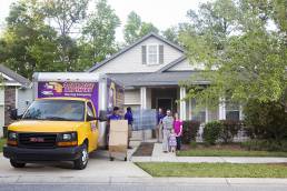 moving customers in front of home with their movers in driveway