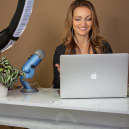 podcaster using apple laptop